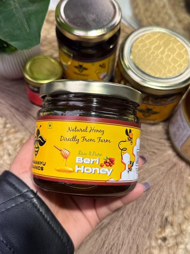 A jar of Abhimanyu Organics Beri honey held in hand